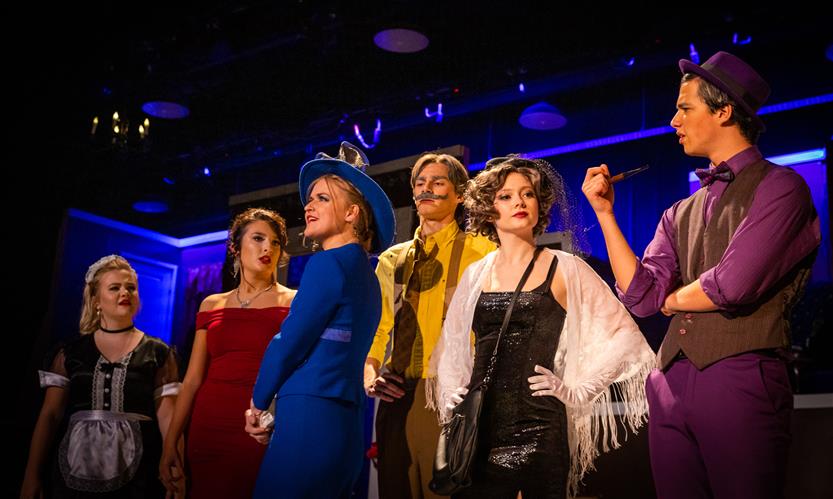 Students perform Clue onstage